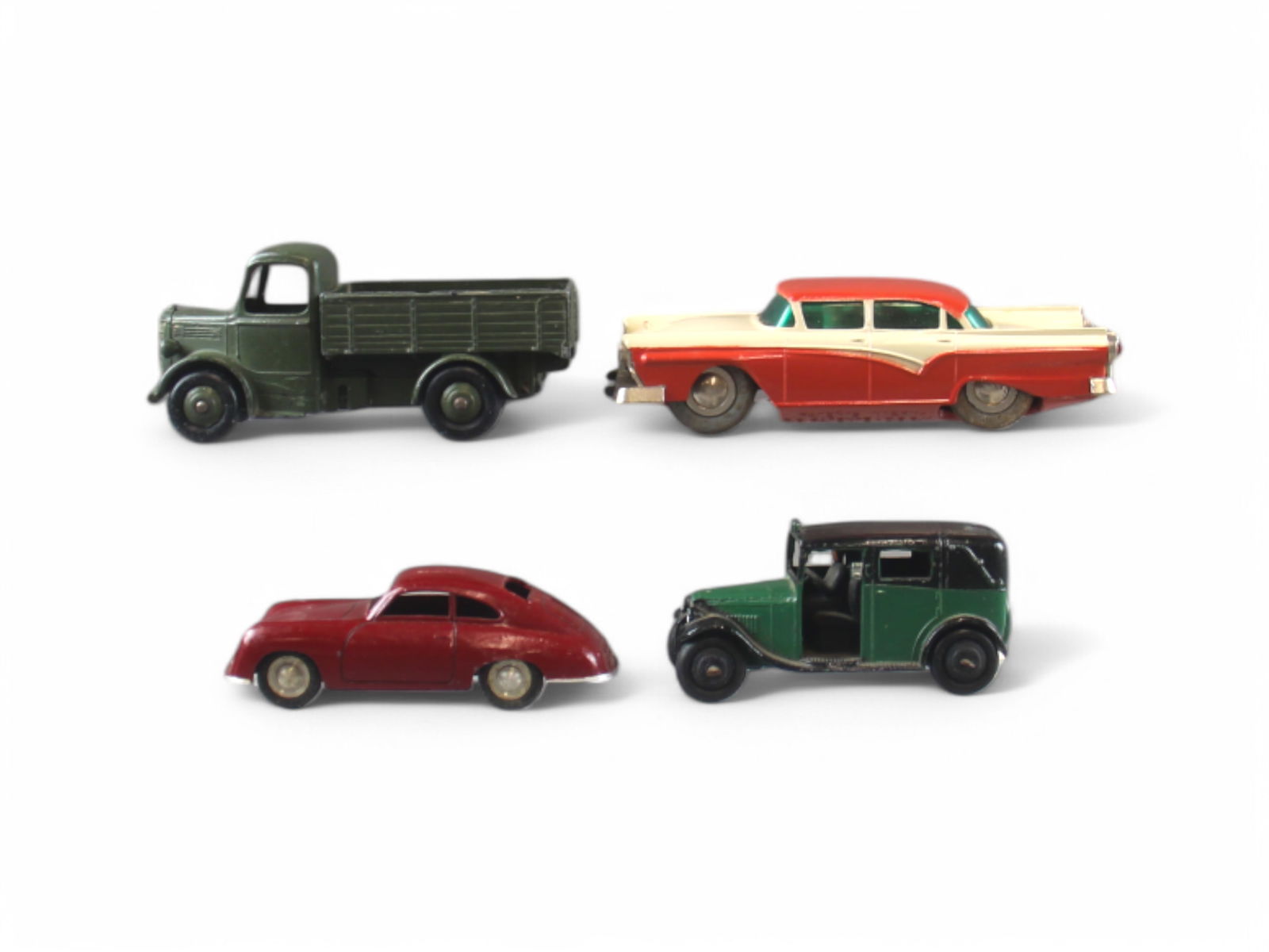 Die Cast Vehicle Lot (4): Includes Schuco Micro Racer 1045 Ford Wind Up, Dinky Bedford Military Vehicle, Early Dinky Sedan and Marklin 2 Door Sedan.