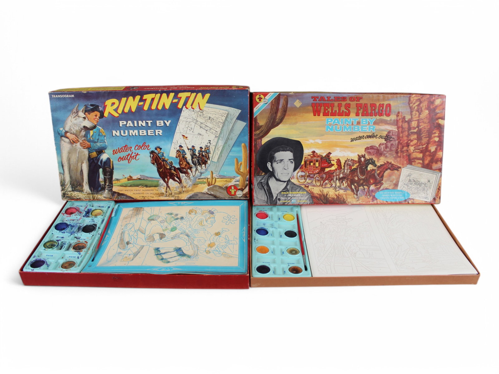 Transogram Lot of (2) Paint Sets: Lot includes Tales of Well Fargo and Rin Tin Tin Paint Sets. Both have been used but appear complete. Box Graphics make this worthwhile by themselves.