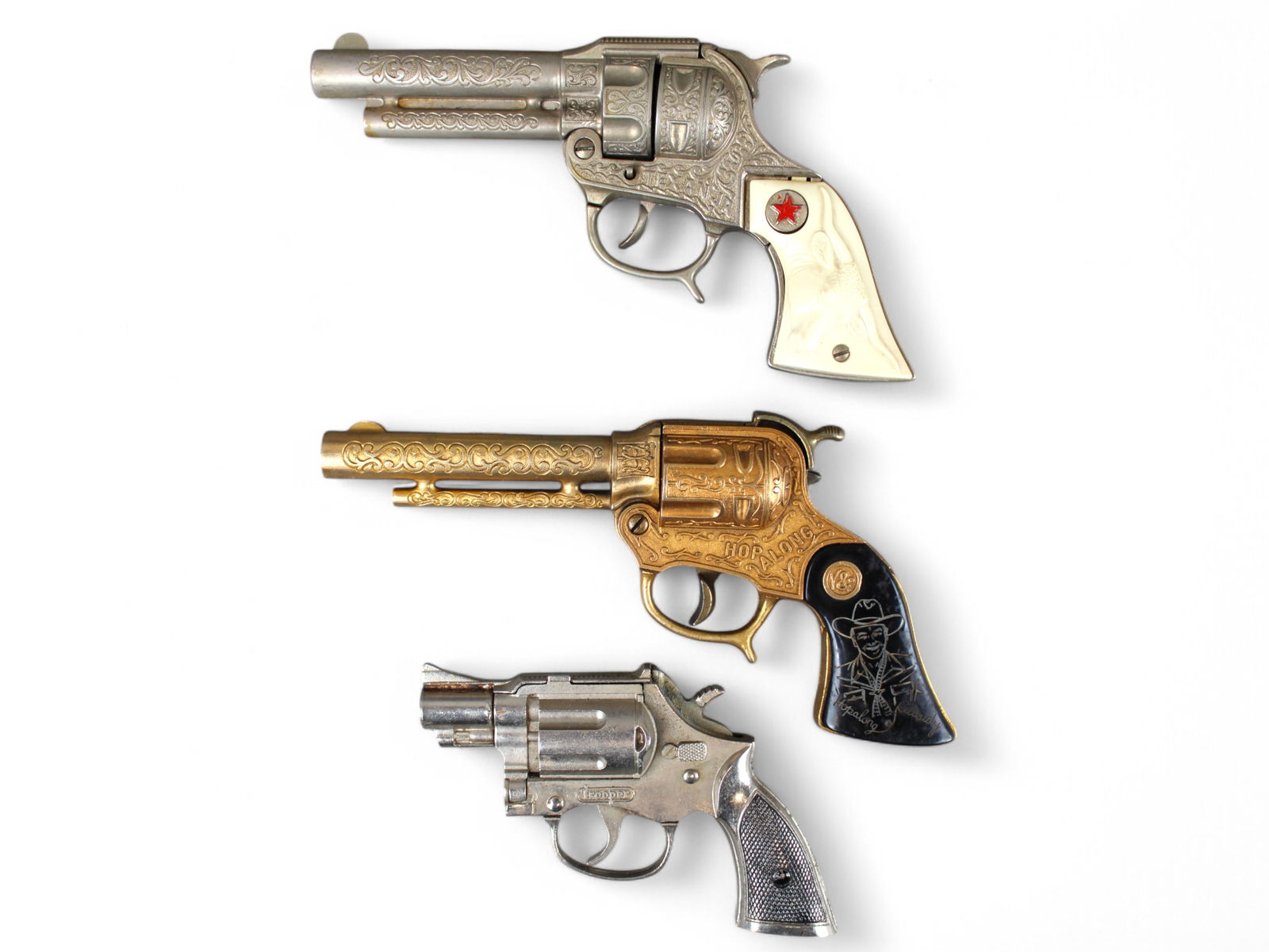 Vintage Cap Gun Lot of (3): Includes Texan Jr, Hopalong Cassidy and Hubley Trooper.