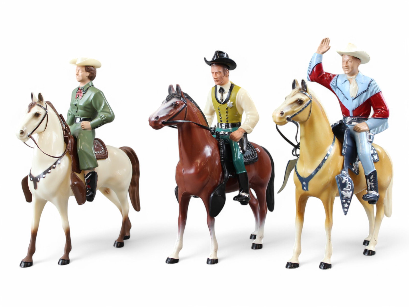 Hartland Roy Rogers, Dale Evans, and Wyatt Earp: 3 piece lot. Includes Hartland Roy Rogers with hat and 2 pistols, Dale Evans with hat and pistol, and Wyatt Earp with hat. Horses and saddles are also included. All pieces show some playwear. We are u