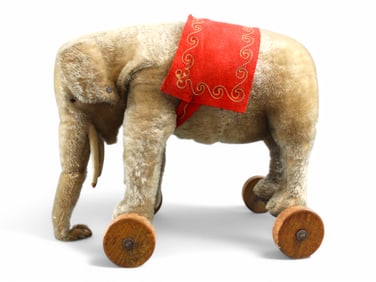 Glass Eyed Elephant on Wheels.