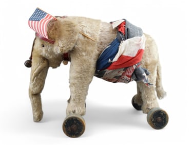 Glass Eyed Elephant on Wheels.