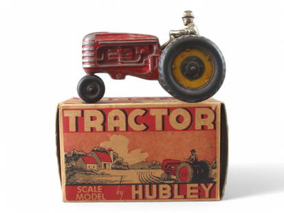 Hubley Kiddie Toy Tractor in Original Box: Metal body with rubber wheels. Approx. 6-3/4" long. Nickel plated driver. Shows playwear with paint loss and scuffing. Comes in the original box which has some edge/corner wear, light stains.