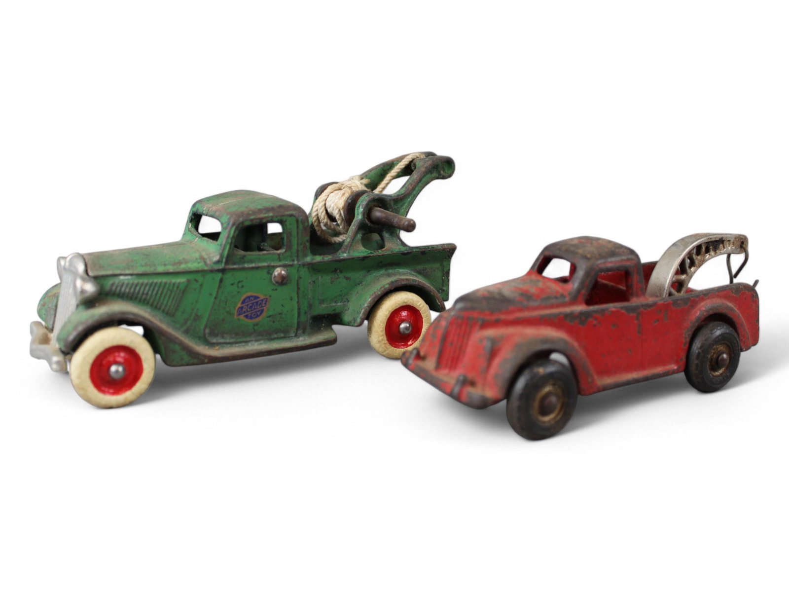 Lot of (2) Cast Iron Tow Trucks: Includes a Nice Arcade with decal, 6 1/2" and another maker 6" long. See images for details.