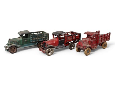 Lot of (3) Cast Iron Stake Trucks