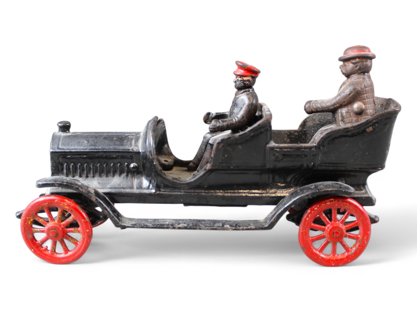 Cast Iron Touring Car: 10" with Driver and One Passenger which may or may not be correct. No Steering Wheel. Over all nice original condition.