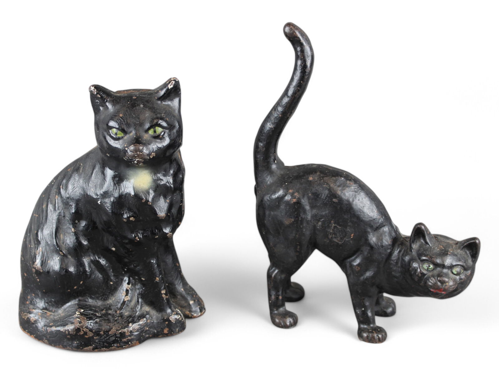 Lot of (2) Cast Iron Black Cat Doorstops: Lot includes Sitting Cat 9" tall, white chest and green eyes together with Standing Cat, Tall up 10" tall. Both vintage.