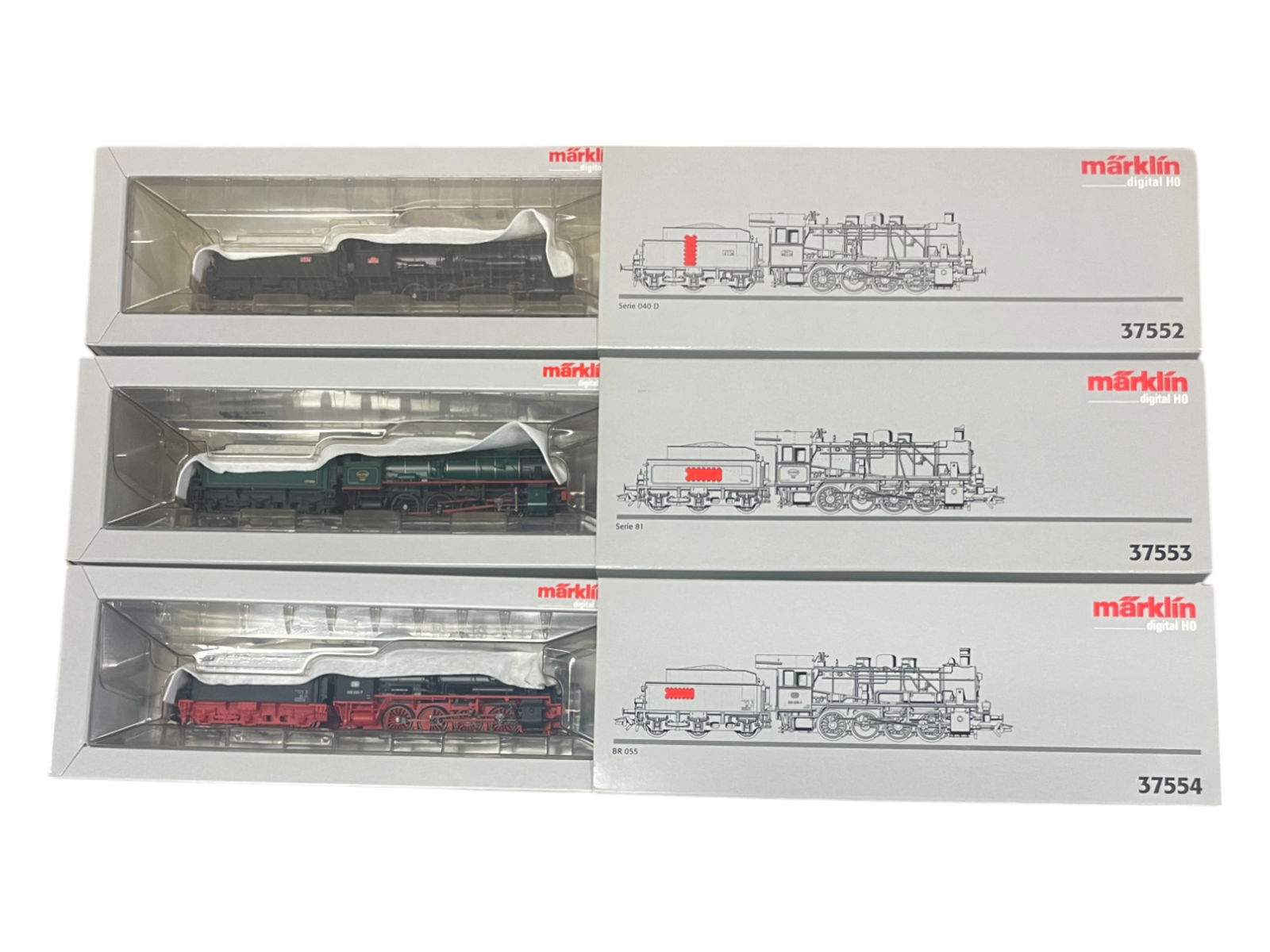 3 Digital Marklin HO Steam Locomotives: Includes 3 variations 0-8-0 switcher with 37552 Danish Serie 040d; 3753 French Serie 81; 3754 German BR055. They are factory new in boxes.