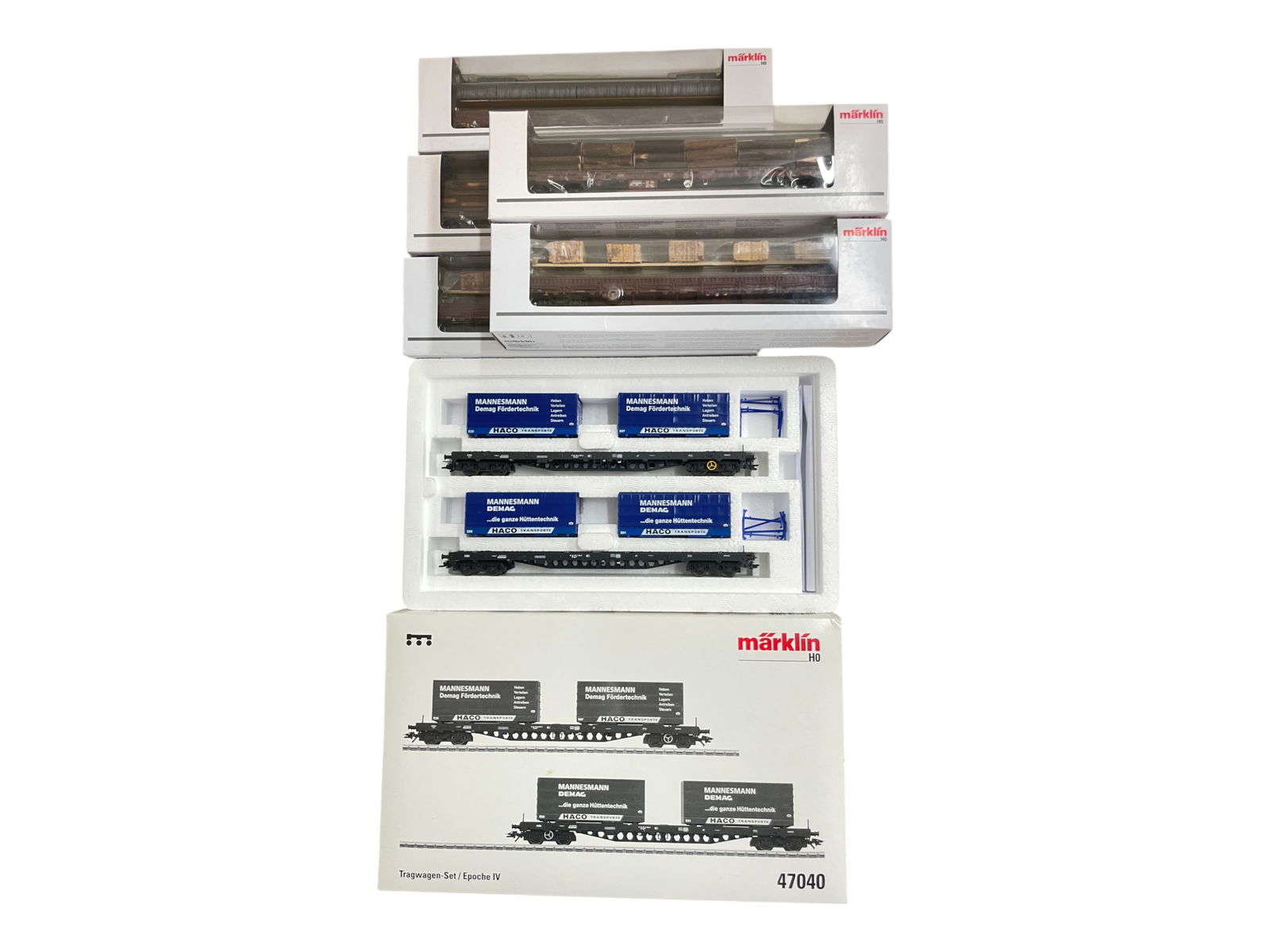 6pc Marklin HO Bogey-Truck Freight Cars: HO Gauge. Includes 47040 2-container flats set; 2-47008 Log carriers; 2-47042 Marble Block Carriers; 47033 Pipe Car. All are new in boxes.
