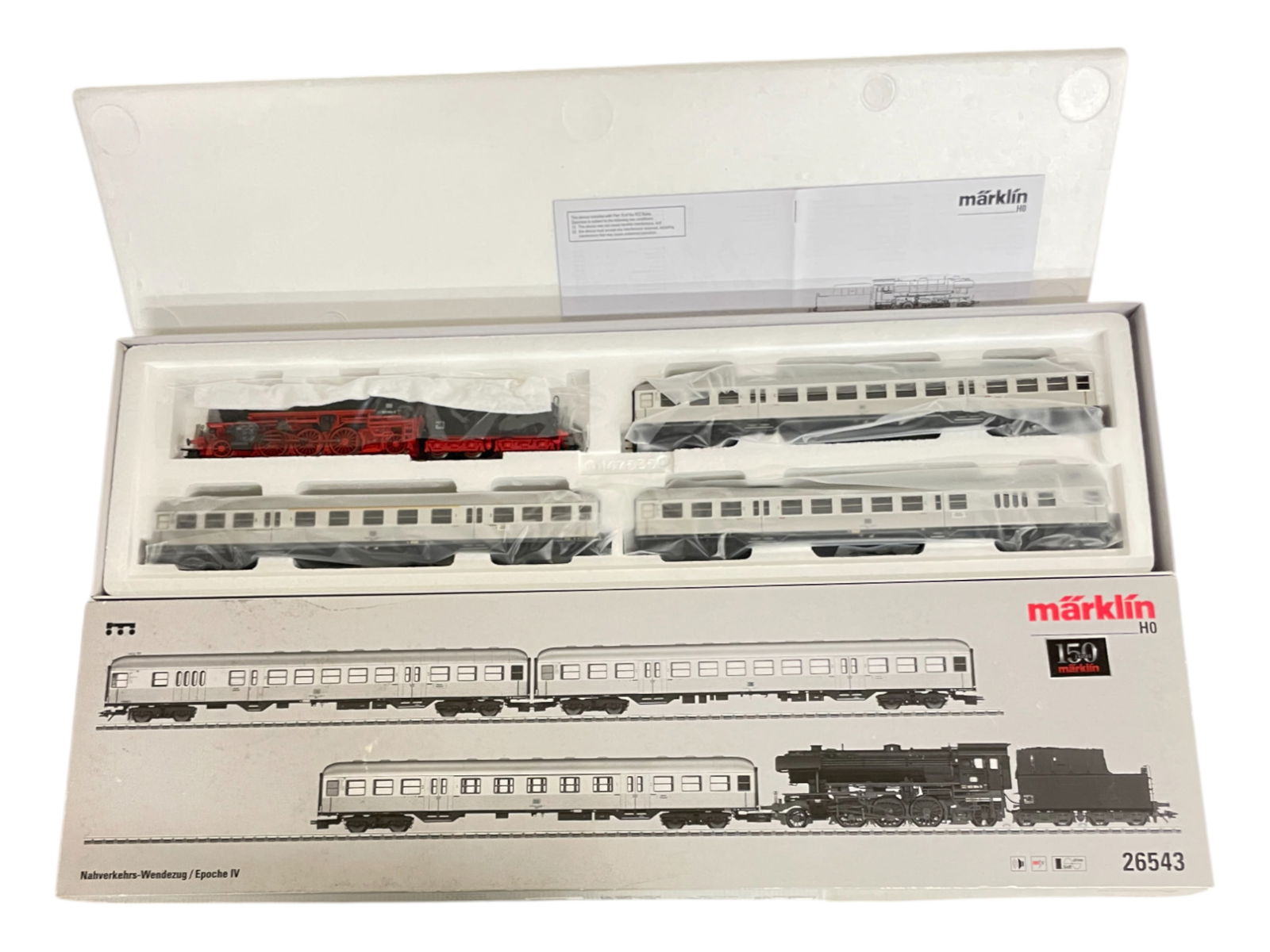 Marklin Digital HO 26543 Commuter Shuttle: HO Gauge. Includes a BR23 208-2 Mogul equipped with Sound, mfx control and SoftDrive with 3 Express Commuter Cars. It is new in set box.