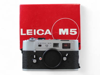 Leica M5 Chrome 50 Year in Box: Leica M5 chrome camera with 50 Jahre emblem in original box. Serial number 1378036 with matching serial number on box and interior bag. With original instruction booklet, Owner's registry card (with m