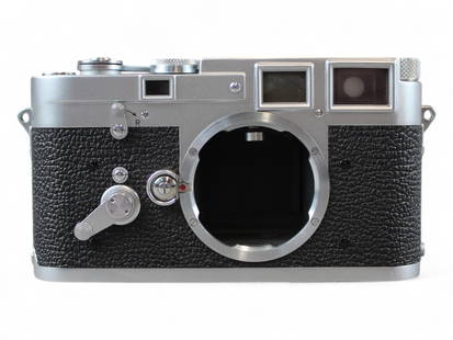 Leica M3 Double Stroke Camera First Year: Leica M3 Double Stroke camera serial number 700219, made in the first year of production, 1954. Very minor wear to camera body; leatherette covering on back plate no longer present.