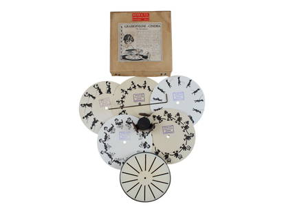 Reid & Co, Gramophone Cinema, Kinephone w/Box: The Gramophone-Cinema or (The Kinephone) is an early 20th century novelty device that fits over the spindle of a gramophone record player and provides a visual cinema as the record spins. Included "re
