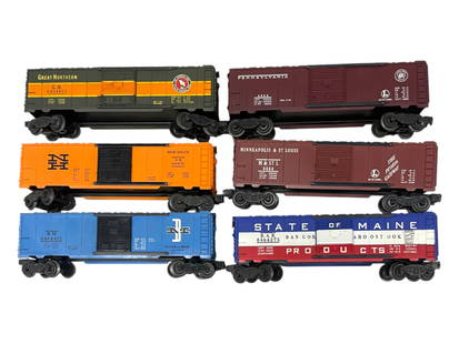 6 Lionel 6464 Boxcars: Includes 6464-475 B&M, Type IIB; 6464-450 GN, Type IIA; 6464-735 NH, metal trucks, type IV; 6464-50 M&StL, type I; 6464-275 SOM, type III; 6464-200 PRR, Type I. They would benefit from a cleaningand s