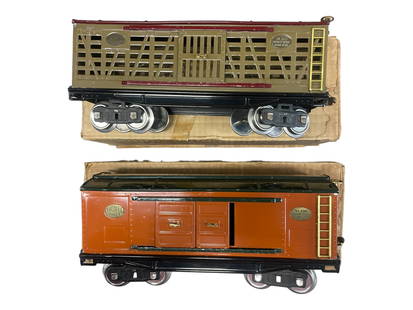 Boxed Lionel Early 213 & 214 Freights: Standard Gauge. 1927. Includes a 213 Cattle car, Mojave & Maroon; 214 Boxcar, terra-cotta & Dk. Green. They are clean and shiny, showing light to moderate play wear with worn boxes.