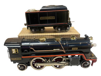 Clean Lionel 390E Steam Locomotive: Standard Gauge. Shiny example with fairly straight frame. Rewheeled and they turn freely; 390T tender with box. They show light play wear, repro flags. Nice!