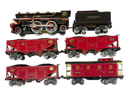 Clean Lionel 390E Coal Train Set: Standard Gauge. 1930. Includes a 390E Steam Loco rewheeled and turns freely. Very slight warp to frame. 390T Tender; 3 -516 Hoppers, all with r/s data, 1 is nice, one shows light play wear, othermoder