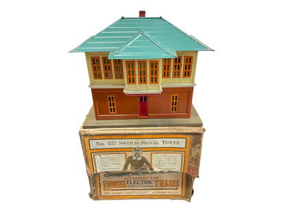 Clean Boxed Early Lionel 437 Switch Tower: Standard Gauge. Has nice unhandled patina with peacock roof. We see two flaws: missing one chimney flange and a scratch on one side. The instructions underneath are unusually clean andbright and the t