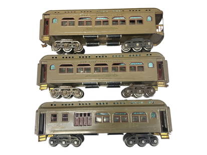 3 Lionel 400 Series Passenger Cars: Standard Gauge. Includes a 419 combine; 418 Pullman; 490 Observation. All mojave with woodgrain doors and maroon trim, 6-wheel trucks. 2 roofs have light bubble wrap shadows, all areclean, showing lig