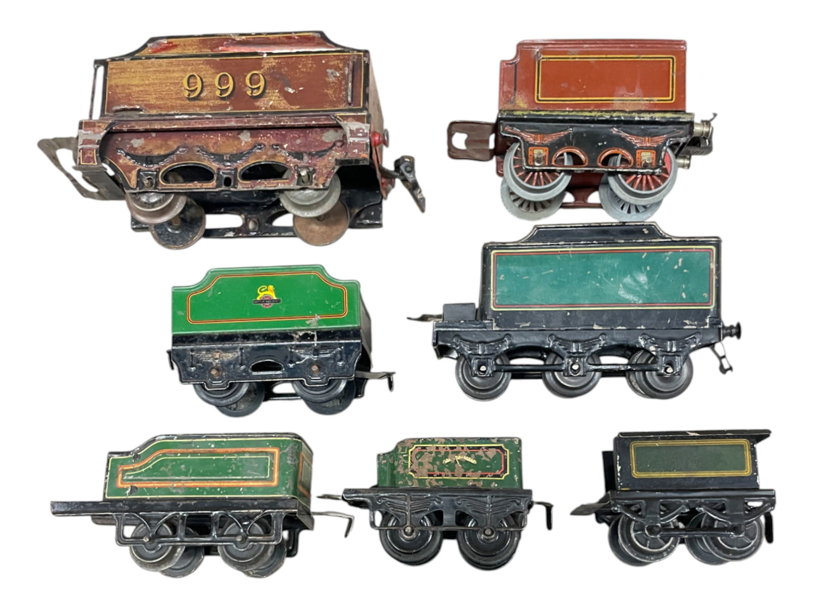 7 European O Gauge Tenders: Includes 2 Marklin; one Hornby; 3 KBN and a Bing. Marklin 999 has finish disturbance, others show light to moderate play wear. From The Estate Collection of Joel Cane.