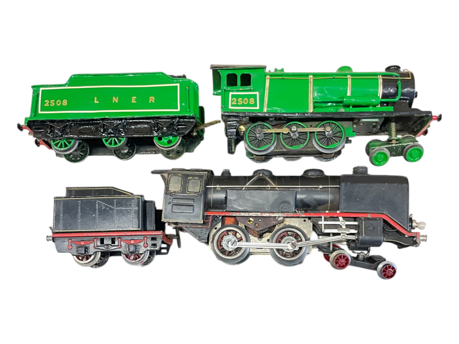 2 Kit Bashed German Style Locomotives: O Ga. Includes a Marklin R920 Electric with Lionel Motor installed; R990/0 tender; Kit bashed brass 2508 4-6-0 loco & tender with LNER livery. Sold as photoed. From The Estate Collection of JoelCane.