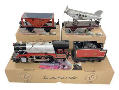 3pc Boxed Paya Steam Freight Set: O Gauge. 1970s. Includes a 983 P&H 425-B-2 2-4-0 Steam loco & tender, 3-rail electric; 1130/8 20 Ton Hopper; 1306 Flat with Airplane. All are new in boxes with insert and paperwork.