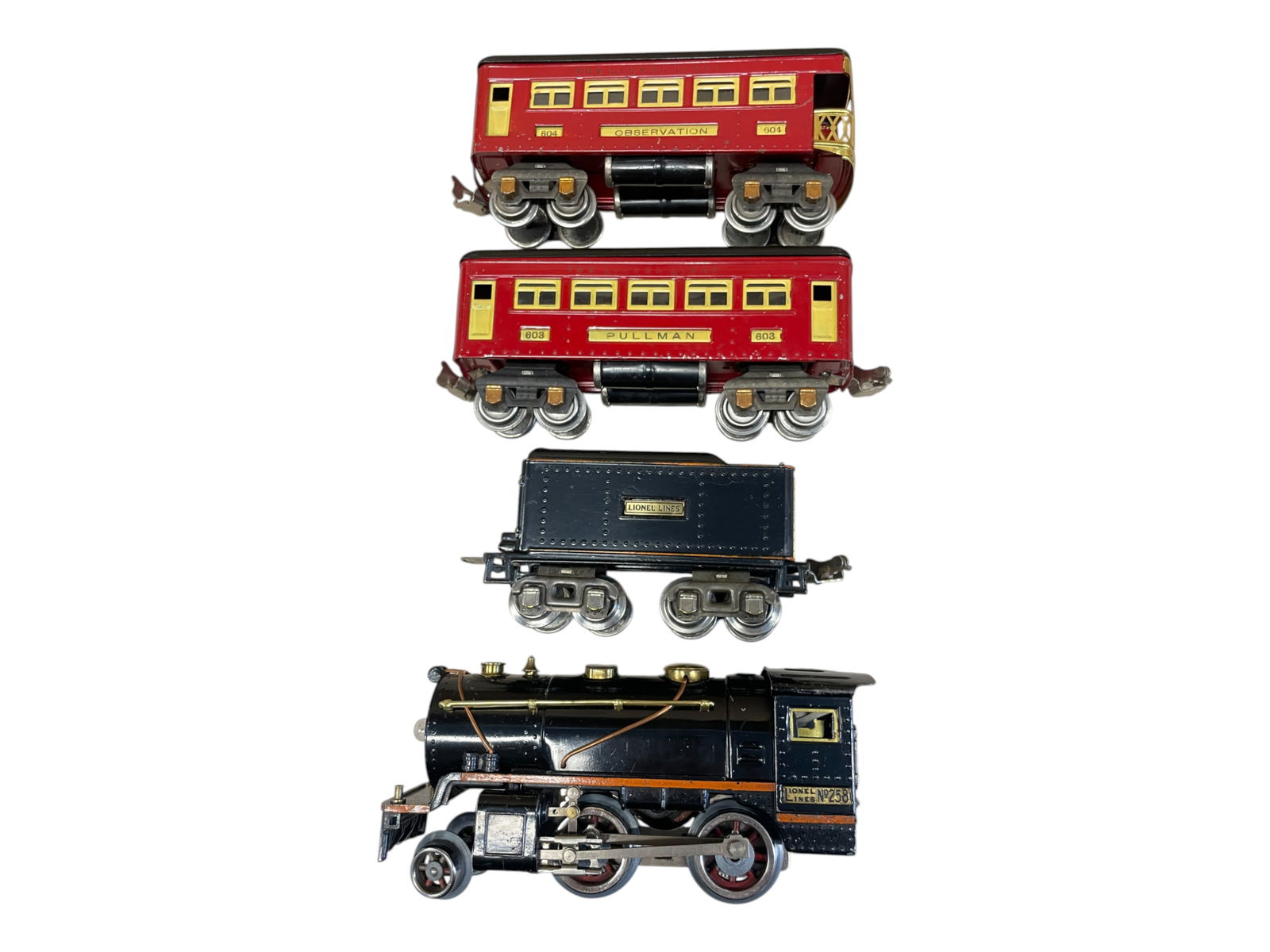Nice Lionel 258 Passenger Set: Includes a 258 2-4-0 steam loco; 258T Cast tender; 603 Pullman; 604 Observation. All are clean and shiny, showing light play wear.