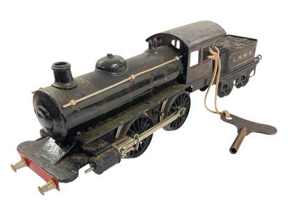 Bing 2588 Gauge 1 LNWR Steam Loco: 1 Gauge. Litho tin with functional clockwork mechanism with start/stop with key; LNWR tender. They would benefit from a clean and polish, showing moderate play wear.