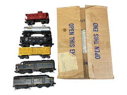 Nice Boxed 1953 Lionel Set 1467W: Includes a 2032 Erie Alco AA Diesels with 98% decals intact. Clean battery box; 6656 Cattle; 6456 Hopper; 6465 Tank, bright silver; 6357 Caboose(needs a light cleaning), 1033 Transformer. Rest show ve