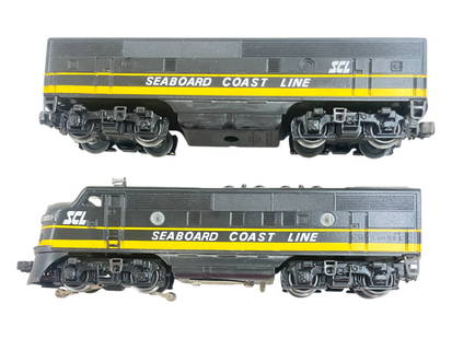 Custom Painted Lionel Dual Motor F3 AB Diesels: Done in Seaboard Coast Line. Nice job with good details. Dual Motor chassis shows moderate run time with clean battery box.