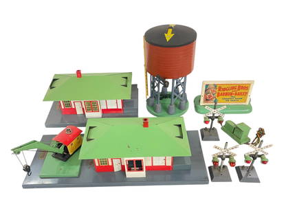 8 American Flyer Accessories: S Gauge. Includes a 596 Water tank; 612 Passenger/Freight station with crane; 755 Talking Station, just missing button; 577 Ringling Bros Whistling billboard, no button; 3 #760 flashers, 2 missing fin