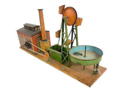 Elaborate Bing Clockwork Steam Toy: 1920s. Litho tin with enamel painted base, 5 X 19?. Factory has swing open doors showing a steam boiler with on/off switch. Wind-up mechanism functions with key, works water pump, missingagitator in b