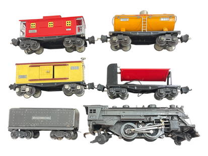 6pc Lionel 228 Steam Freight Set: 1939. Includes a 229 Steam loco; 2689W tender, gunmetal. Tender has postwar trucks; 2654 Shell tank; 2655 Boxcar; 3659 Coal Dump; 2657 Caboose. All are clean and shiny, cars a grade higher thanthe loc