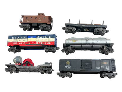 6 Clean Lionel Freight Cars: Includes a 6464-225 SP Boxcar, Type IIA; 3650 Searchlight Extension car, complete; 6464-275 SOM Boxcar, type IIA Grooved; 3461 Log Dump; 6457 Lighted caboose; 6415 3d tank. All show light play wear.