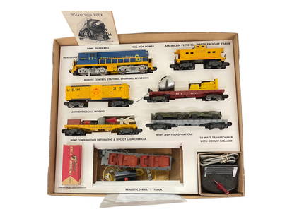 American Flyer Defender Set (25025): S gauge. 1958. Includes a 21234 C&O GP7 Diesel with bell. Long step version; 24557 Navy Flat with TootsieToy Jeeps; (25056) USM Fuel Drum Unloader/Rocket Launcher set with drums, rocket,button & rail;