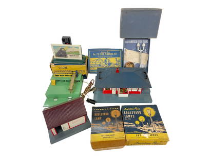 8 American Flyer Accessories: S Gauge. Includes boxed 568 Whistle with button; 755 Talking Station with complete insides, missing button; 770 Loading Platform; 580 Lamppost with display box; Boxed 749 & is 778 3-boulevard lampsets