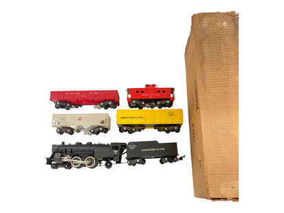 Boxed American Flyer Set 590T: S Gauge. Includes a nice 300AC Reading Atlantic; Scarce White 632 LNE Hopper; 641 Red Painted gondola; 639 Boxcar; 638 Caboose. All show very light use with 3 boxes, boxed track & transformer, some pa