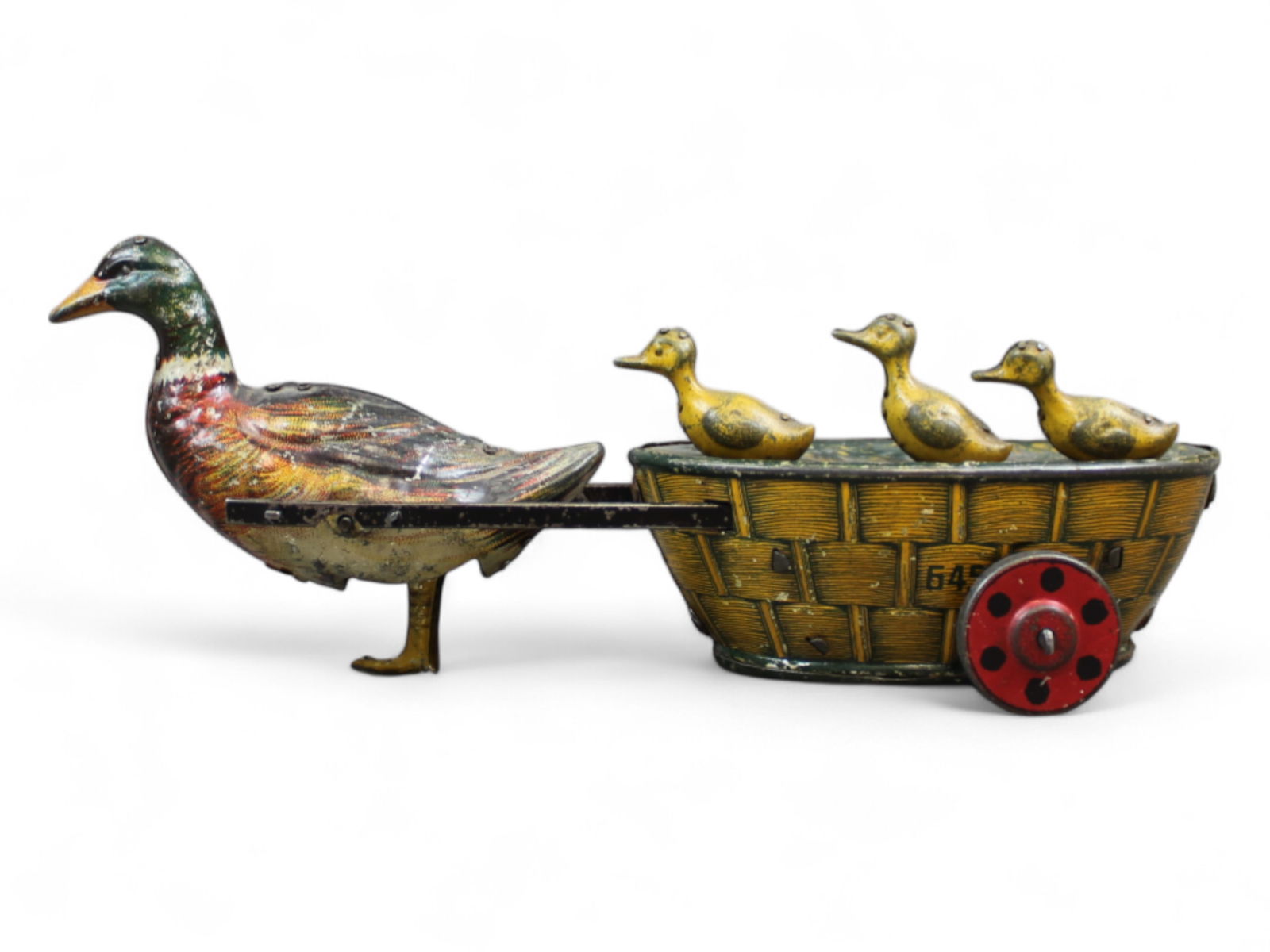 Lehmann Paak-Paak: Lehmann "Paak-Paak" or "Quack-Quack" EPL 545, from 1910, Mother duck with 3 ducklings in a basket, lithographed tin, clockwork, working, length 7 ? in. Works sporadically. Winds and wheels spin.