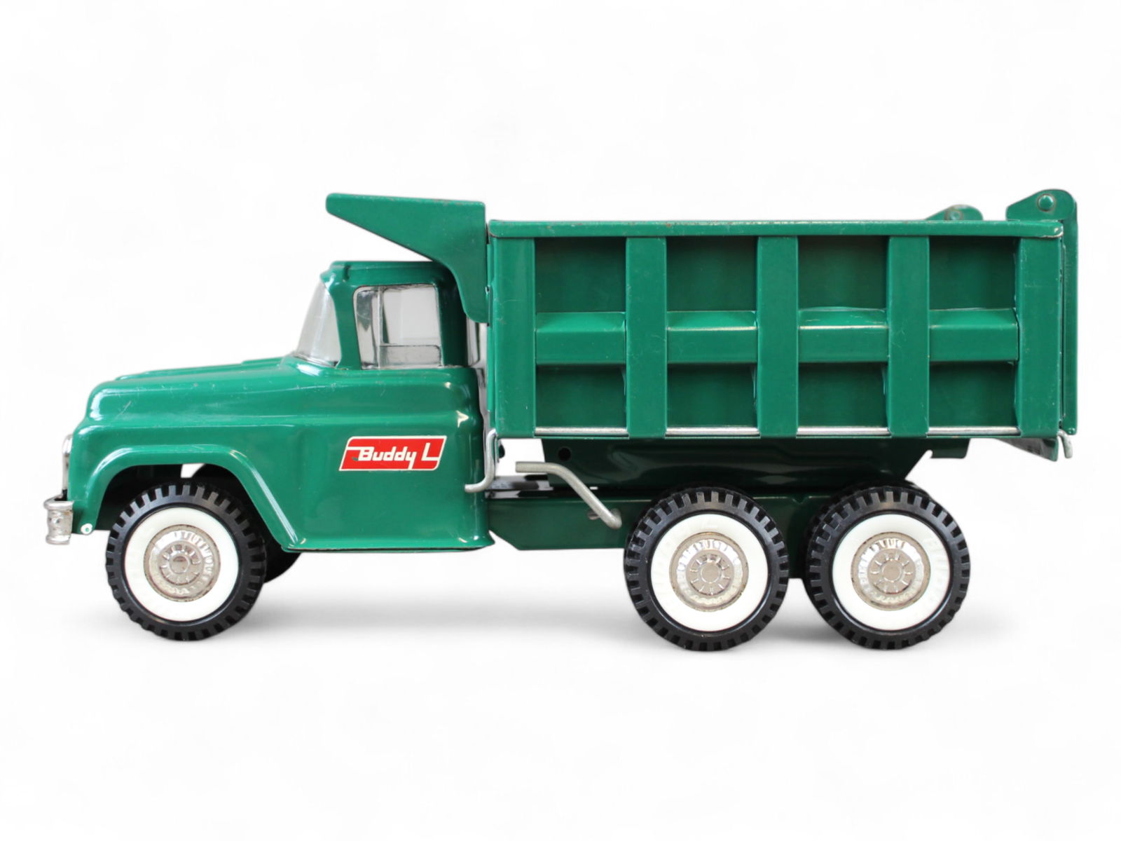 Buddy L Pressed Steel Hydraulic Dump Truck: Buddy L Pressed Steel Hydraulic Dump Truck. Professionally restored; some crazing to paint. Hydraulic dump mechanism works smoothly. Approx. 14 3/4'' long.From the Gary Slutzky Collection of Pressed S