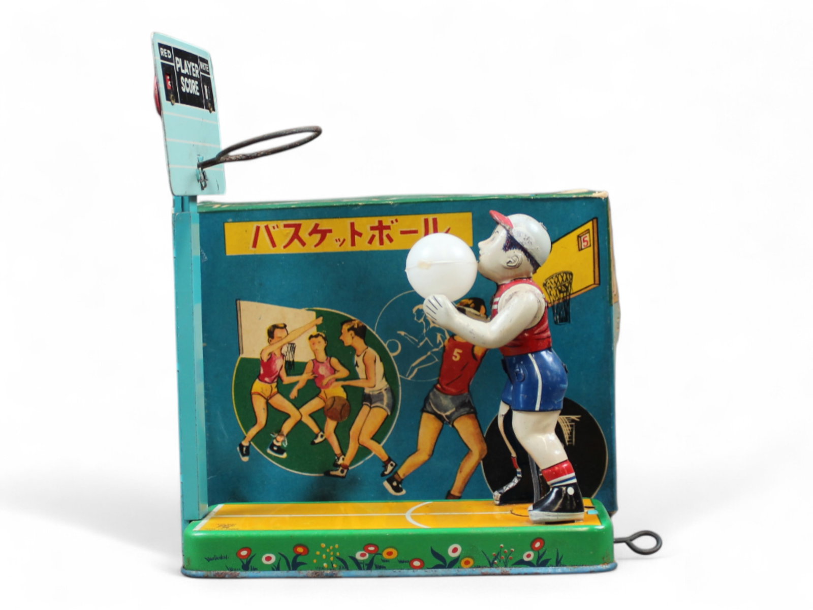 Boxed Tin Litho Japanese Basketball Player Toy: A.T.C., made in Japan. Tin lithographed, pull tab to shoot basketball. Includes original scoreboard and one ball. Hoop is missing the net. Approx. 7" x 8". Toy shows playwear with scuffs, and scratche