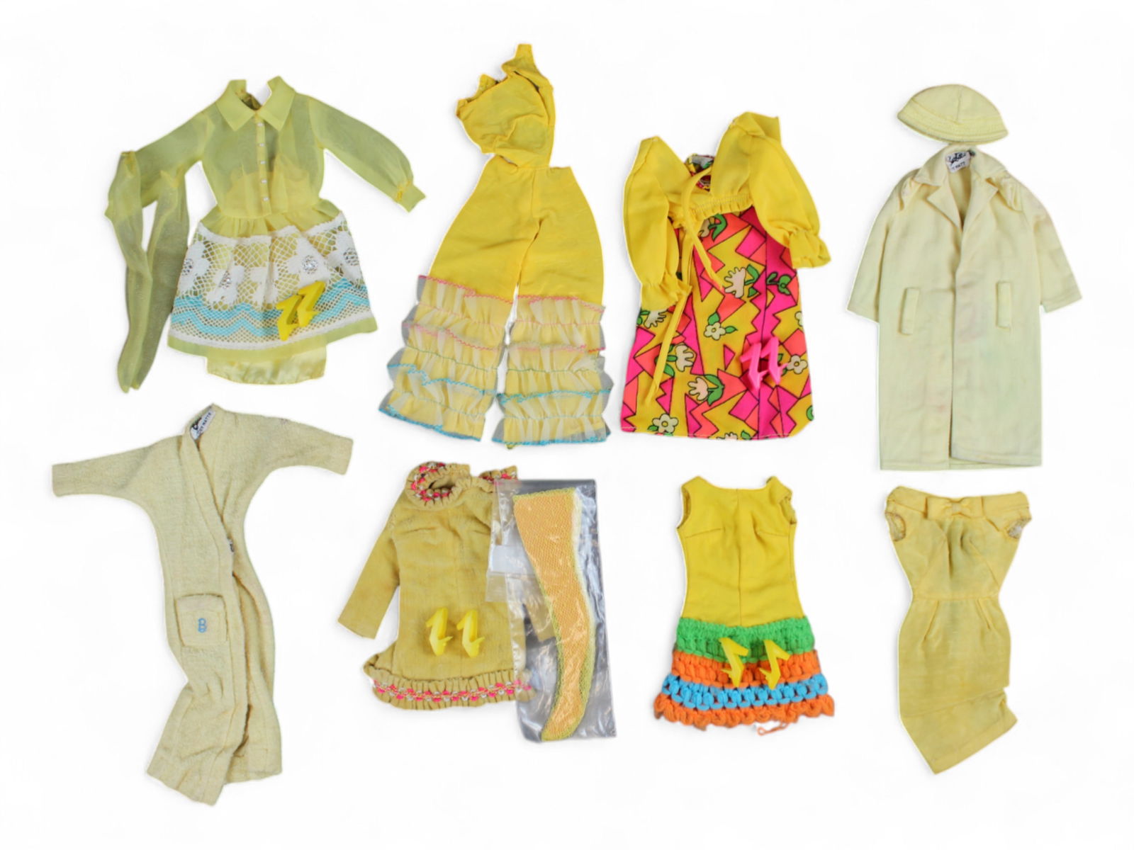 1960-70's Barbie Yellow Fashion Outfit Lot (8): 1960's and 1970's Mattel Barbie bundle lot of yellow themed fashions. Includes #1484 Yellow Mellow, #1454 Loop Scoop, #1687 Caribbean Cruise, #1487 Shirt Dressy, #988 Singing in the Shower, #949 Storm