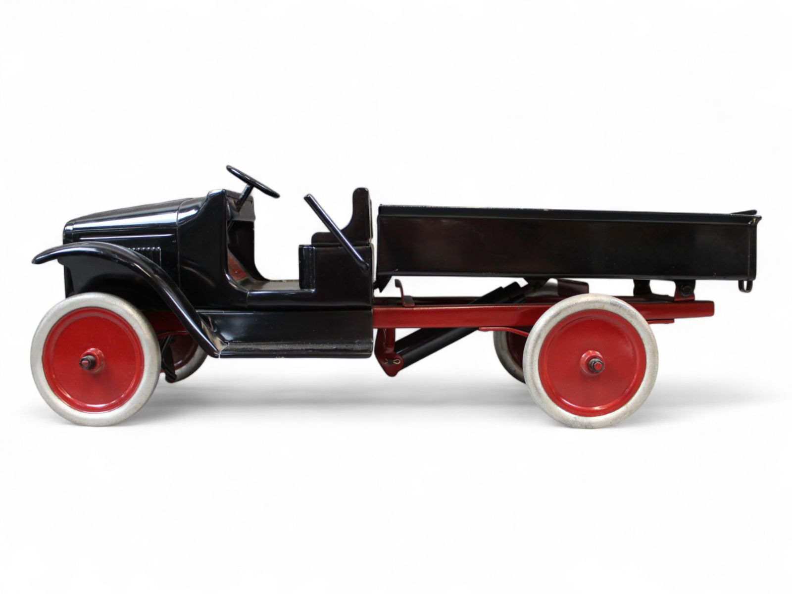 Restored 1927 Buddy L Hydraulic Dump Truck: Pro job paint wise. Painted pressed steel with steel wheels, 24? long. Hydraulic piston has leak, so springs up fast. Nice looking truck.