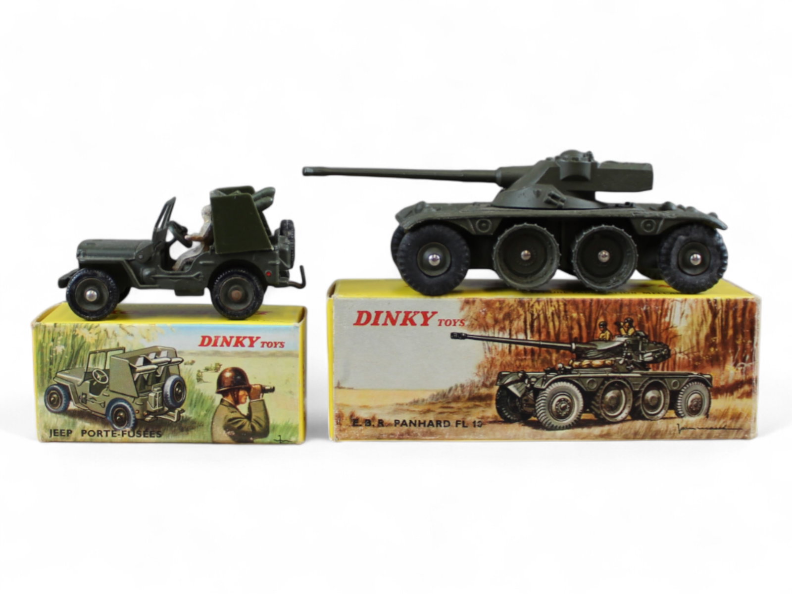 French Dinky FR827 & FR828 Military Trucks: Includes an 827 Engin Blinde Reconnaissance Panhard; Scarce 828 Jeep with rocket Carrier. They are Mint with nice boxes.