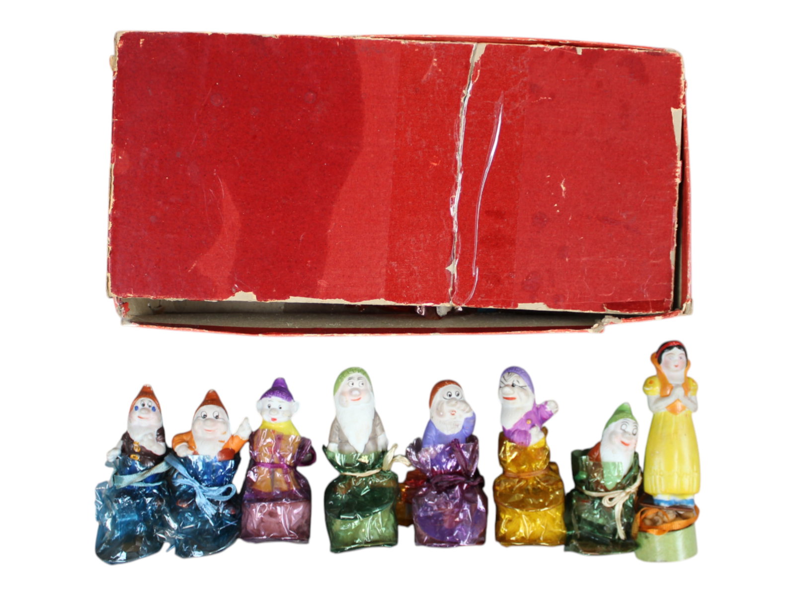 Boxed Candy Crafters Snow White & Dwarves Candy: 1930s. Now we see them in packaging! The bisque hand-painted Disney figures we have been collecting, were actually candy box toppers. Here is a complete set, still cello wrapped on top of full candy b
