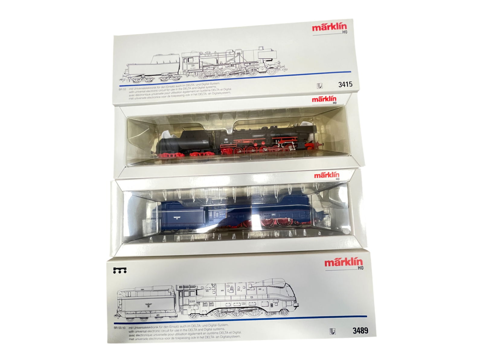 2 Marklin HO Steam Locomotives: HO Gauge. Includes 3415 BR 52 DB 2-10-0; 3489 BR 03.10 Streamline Hudson. They appear new in boxes.