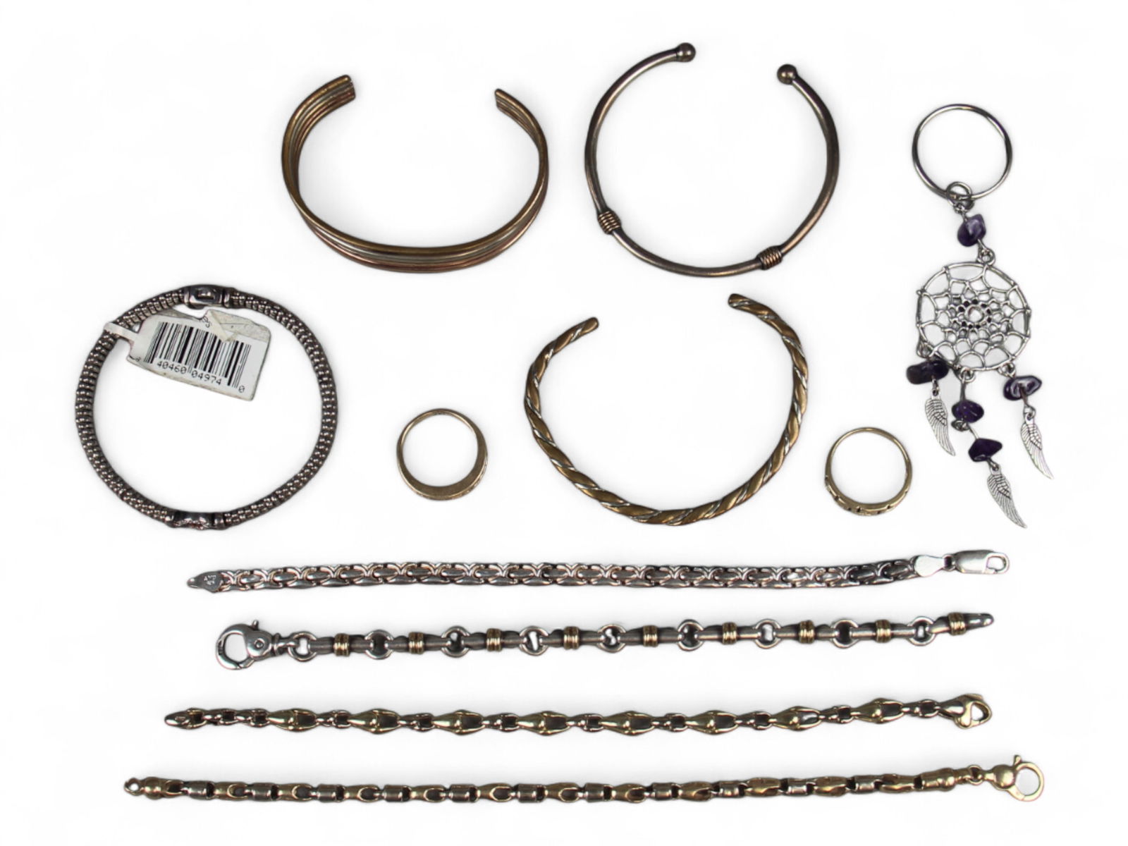 Estate Jewelry Collection: Estate jewelry collection including four silver and gold-accented bracelets, two sterling silver bracelets, two costume bracelets, two 14k yellow gold rings, and one costume/keychain dreamcatcher. Shi