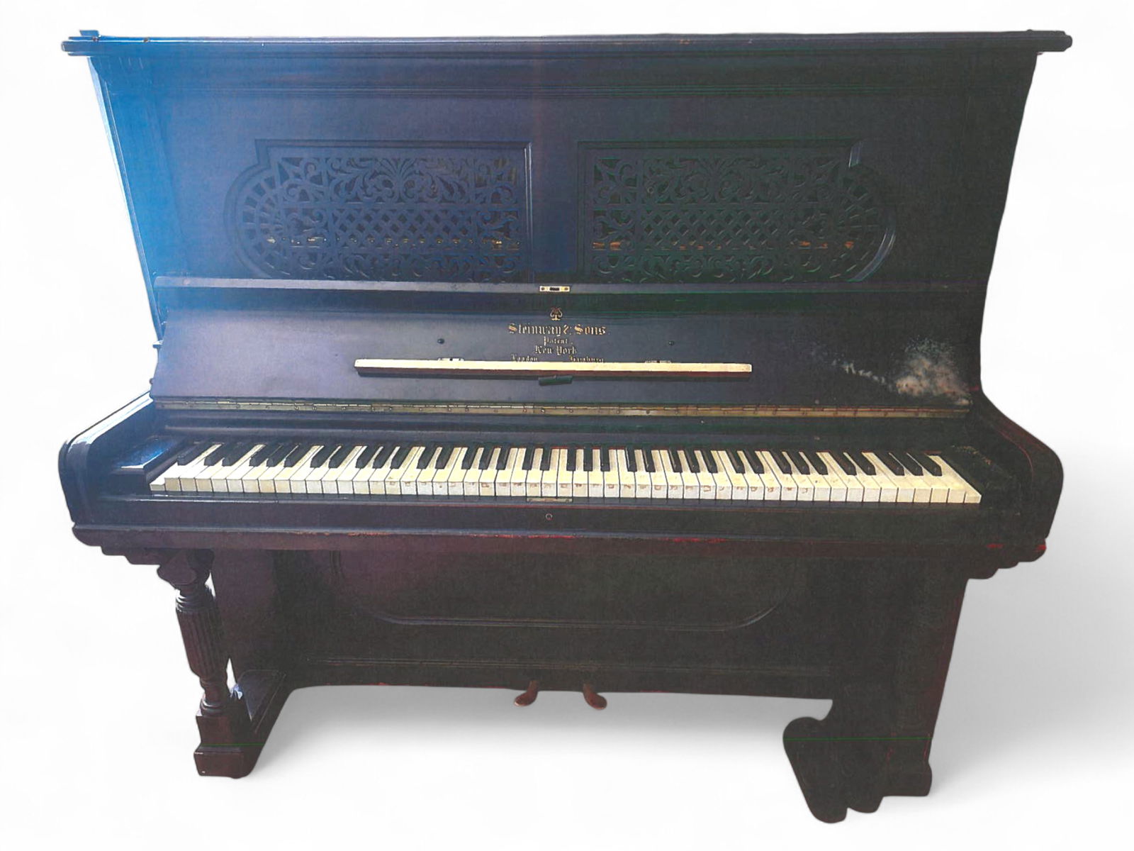 Steinway and Sons Upright Piano: Antique upright piano by Steinway & Sons, serial no. 75312, manufactured in New York in 1892. The case features a classic black lacquer finish with ornate carved music desk and the "Steinway & Sons Pa