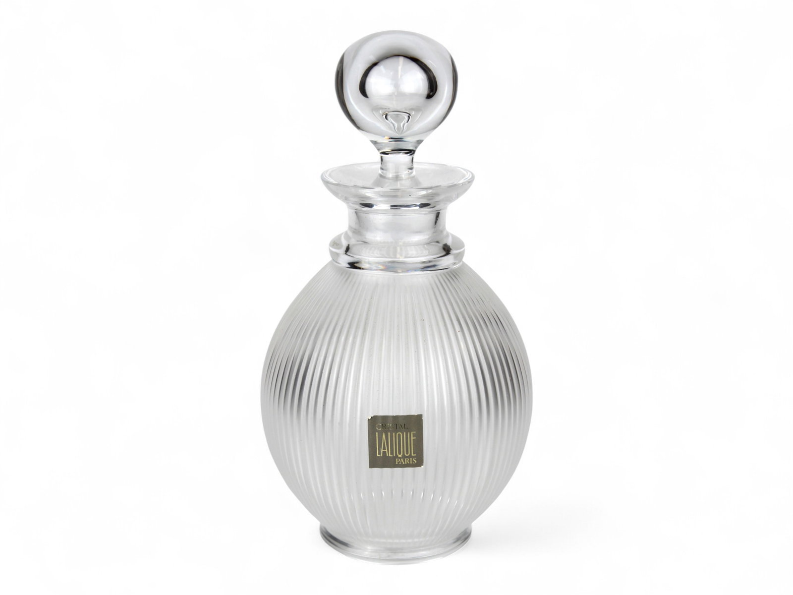 Lalique "Langeais" Decanter: Clear and frosted crystal produced in the "Langeais" pattern. Ribbed teardrop form body with spherical stopper. Signed "Lalique France". Approx. 10" high with stopper x 5" wide. "Cristal Lalique Paris
