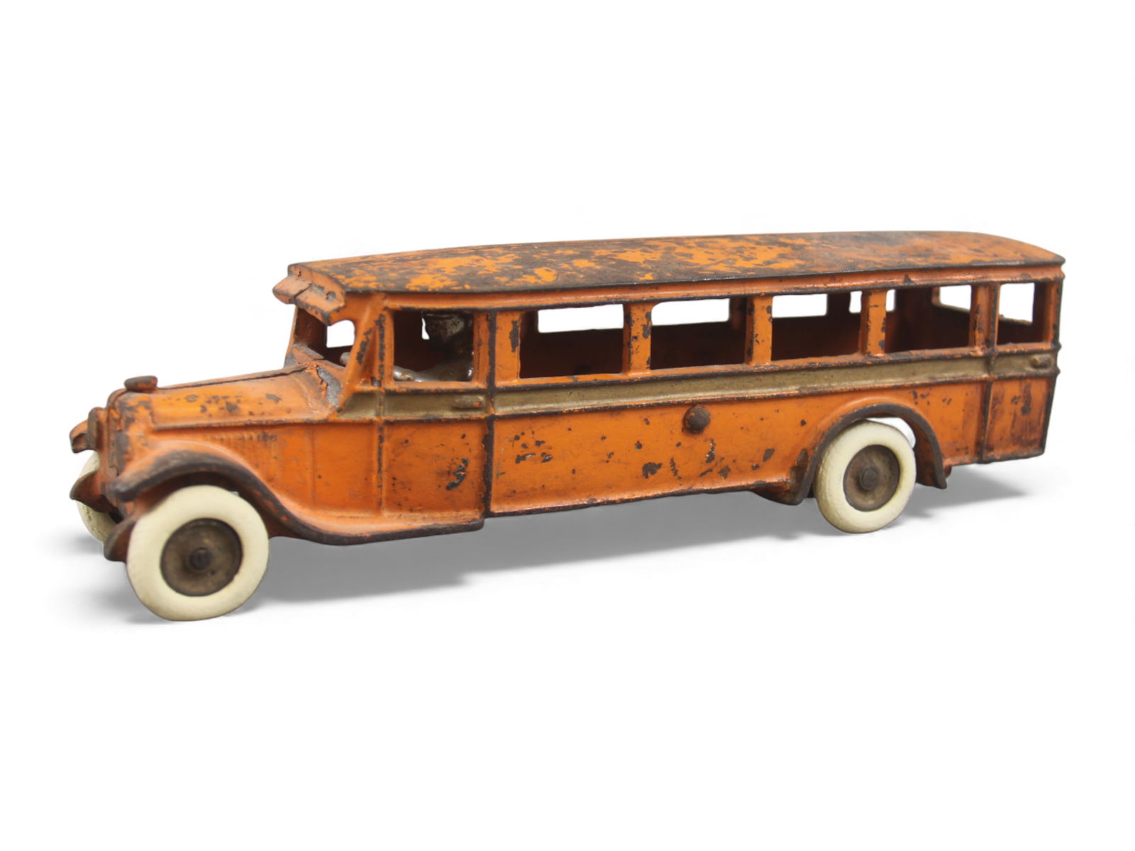 Arcade Cast Iron Bus: Arcade cast iron bus measuring approx. 9" long with white rubber wheels (possibly replaced). Retains about 70% original paint with expected wear and loss from age. From the Charles Atchison Collection