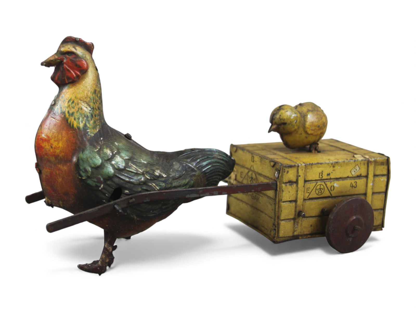 Ebo Hans Eberl Gik-Gak Wind-Up Toy: German Ebo Hans Eberl "Gik-Gak" tin lithographed wind-up toy featuring a walking hen with a pecking chick riding on a wooden crate. Measures approx. 9" long. Working condition when tested. From the